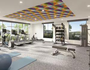 a gym with treadmills and exercise equipment and windows at Home2 Suites By Hilton Del Rio in Del Rio +4 photos