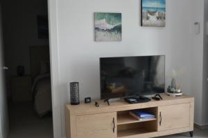 TV a/nebo společenská místnost v ubytování Mariposa Eterna