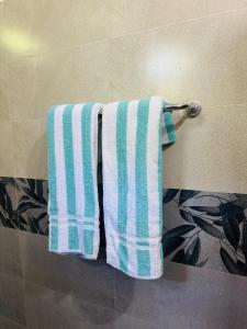 two towels hanging on a towel rack in a bathroom at The La Nature Villa in Wadduwa +21 photos
