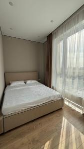 Ένα ή περισσότερα κρεβάτια σε δωμάτιο στο Apartments