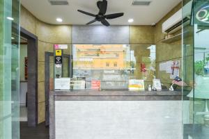 a food counter in a restaurant with a ceiling fan at Hotel Jalan Bukit Ubi Formerly Bumimas in Kuantan