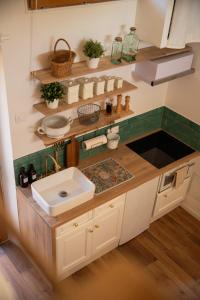 a kitchen with a sink and a counter top at La maisonnette de la gare in Lieuran-lès-Béziers