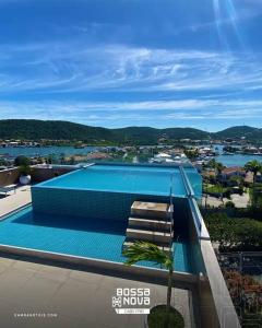 Πισίνα στο ή κοντά στο Flat Hotel Bossa Nova Cabo Frio Passagem
