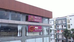 a building with a sign that reads rock hotel houses at Ricch Hotels in Hyderabad