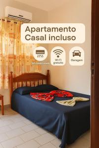 a bed in a room with a sign for an appliancecci institute at HOTEL TAPAJOS Marabá in Marabá