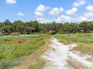 a dirt path through a field with trees at Apartment Melita - 300m from the sea by Interhome in Neksø