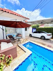 Πισίνα στο ή κοντά στο Casa na praia de boa viagem