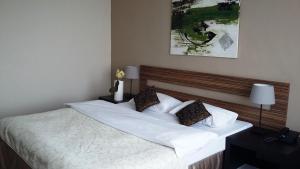 Postel nebo postele na pokoji v ubytování Hotel Cascade