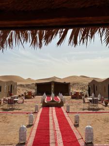 a red carpet in the middle of the desert at Camp Desert Bivouac Chegaga in El Gouera