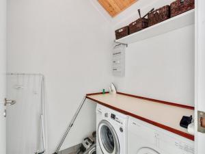a laundry room with a washer and dryer at Holiday Home Verner - 500m from the sea by Interhome in Hasle