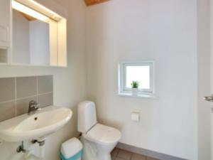 a bathroom with a white toilet and a sink at Holiday Home Verner - 500m from the sea by Interhome in Hasle