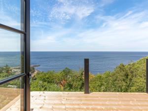 a view of the ocean from a house at Holiday Home Thormoth - 200m from the sea by Interhome in Hasle