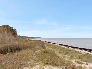 a dirt road leading to the ocean on a beach at Holiday Home Ellin - 800m from the sea by Interhome in Hasle