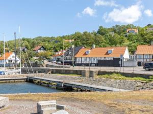 a marina with a train on a bridge and buildings at Holiday Home Lahja - 400m from the sea by Interhome in Hasle