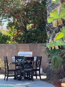 a table and chairs sitting next to a wall at Family Vacation Spot - 4BR Home - FB - Cal in Calabasas