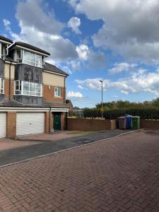 a house on a street with a brick driveway at ResiLets - Berwick House - Large 4 Bed Townhouse - Contractor stays in Cowpen