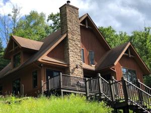 a large wooden house with a chimney at Chalet Boreal Mont-Blanc in Mont-Blanc