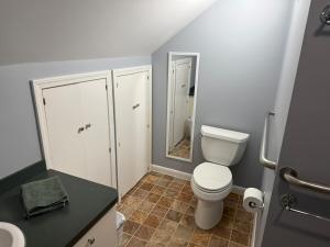 a small bathroom with a toilet and a sink at Old Orchard Kirtland, Ohio  +37 photos