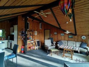 a living room with a couch and a table at Holiday Home Rieke - 300m from the sea by Interhome in Skovmose