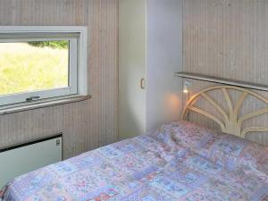 Giường trong phòng chung tại Holiday Home Aasa - 200m from the sea by Interhome