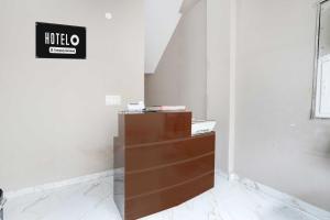 a cabinet in a room with a sign on the wall at Townhouse Sector 33 Gurgaon in Gurgaon