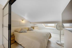 En eller flere senge i et værelse på Le Duplex - à 10 minutes de Paris