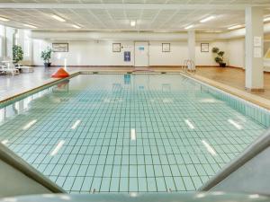 an empty swimming pool in a gymnasium at Apartment Anedorte - 50m from the sea by Interhome in Fanø