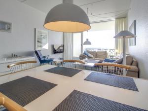 a living room with a table and chairs at Apartment Rubi - 50m from the sea by Interhome in Fanø