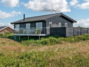 a house on the side of a hill at Holiday Home Ortwin - 300m from the sea by Interhome in Lakolk