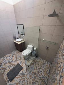 a bathroom with a toilet and a sink and a shower at Fully Equipped 3 beds 2 cars 20-min airport in La Puebla +12 photos