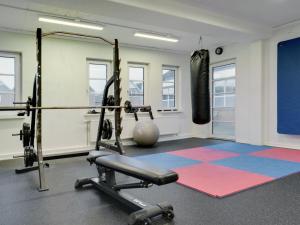 a gym with a punching bag in a room at Apartment Edeltraud - 2-3km from the sea by Interhome in Sønderby