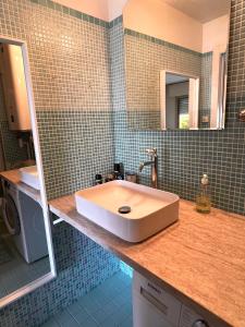 a bathroom with a sink and a mirror at French Riviera - Monaco in Beausoleil +23 photos