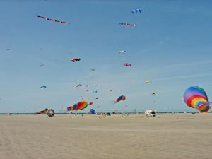 a bunch of kites flying in the sky on the beach at Holiday Home Solina - 500m from the sea by Interhome in Lakolk