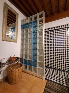 a bathroom with a wall of glass bottles at Riad Al Bartal in Fez +89 photos