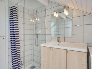 a bathroom with a sink and a shower at Apartment Ameli - 2-3km from the sea by Interhome in Sønderby +25 photos