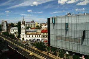 a view of a city with a building and a street at Amo Bucharest in Bucharest