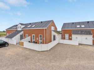 a house with solar panels on top of it at Apartment Anke - 500m from the sea by Interhome in Sønderby +15 photos