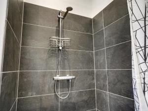 a shower with a hose in a bathroom at Holiday Home Lima - 3-5km from the sea by Interhome in Kongsmark +21 photos