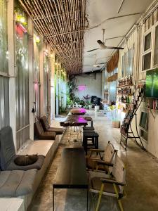 a large room with couches and tables in it at The PARK Society in Chiang Mai