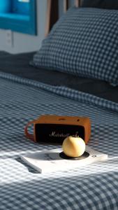 a cell phone sitting on top of a bed at MayHome Binh Dinh in An Hòa