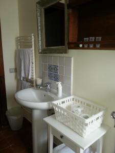 a bathroom with a sink and a mirror at Nanfro Resort - Masseria Spaccaforno in Caltagirone +41 photos