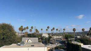 a view of a city with palm trees and a church at Culver Hideaway Private Room with Share Living Space C1 in Los Angeles +16 photos