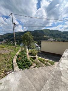a set of stairs with a view of a mountain at Apartment Amila in Jajce +3 photos