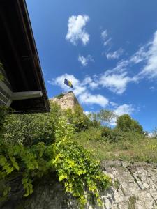 a kite on top of a hill in the sky at Apartment Amila in Jajce