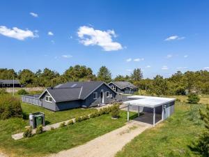 an aerial view of a home with a house at Holiday Home Solvejk - 800m from the sea by Interhome in Vejers Strand