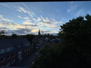 a view of a town with a church in the distance at Ferienwohnung Victoria in Recklinghausen