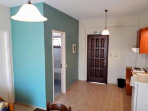 a living room with a blue and green wall at Valias House in Finikounta