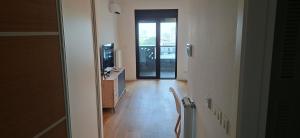 a hallway with a door leading to a room at Park Vila apartment in Belgrade +2 photos