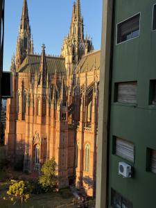 a large cathedral with turrets on a building at Depto 51 in La Plata