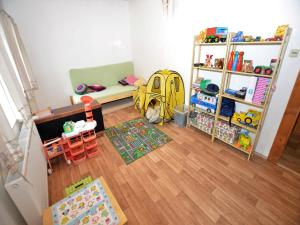 a childs room with a couch and a table at Cottage in Liberec with Sauna and Ski Nearby in Rudolfov +29 photos